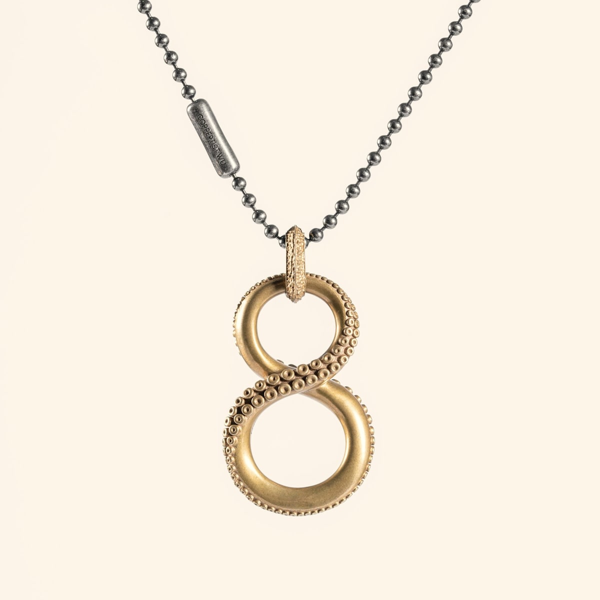 Gouden love knot hanger met verstrengelde ringen